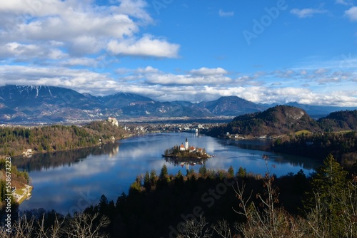 View of lake Bled and the island on the lake with church of the assumption and Bled castle and Karavanke mountains © kato08