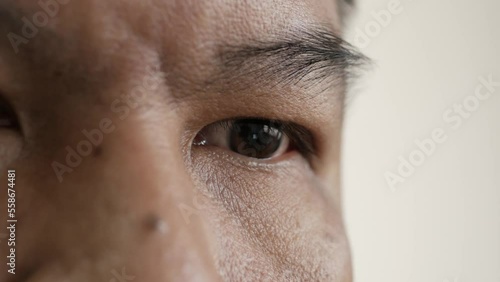 Close-up Asian male eyes thinking about something