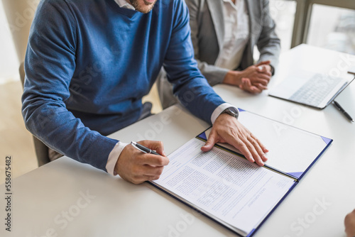 Obraz na plátně Picture of a diverse couple, starting a business, signing a lease