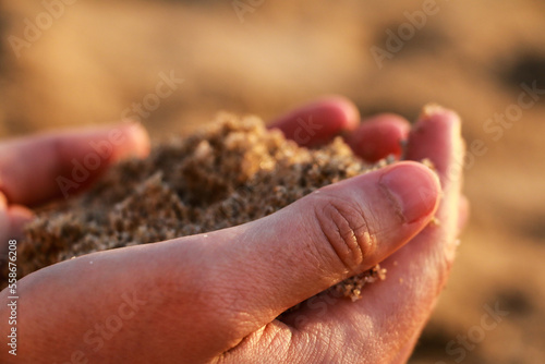 Hand of sand on the beach. Wallpaper sand at holiday. wallpaper sea summer