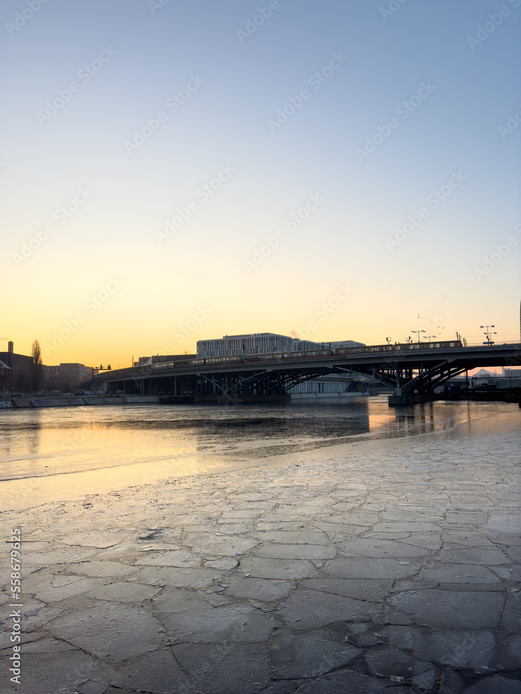 Ice floes in front of the main train station in Berlin, Germany during sunrise on a cold winter morning