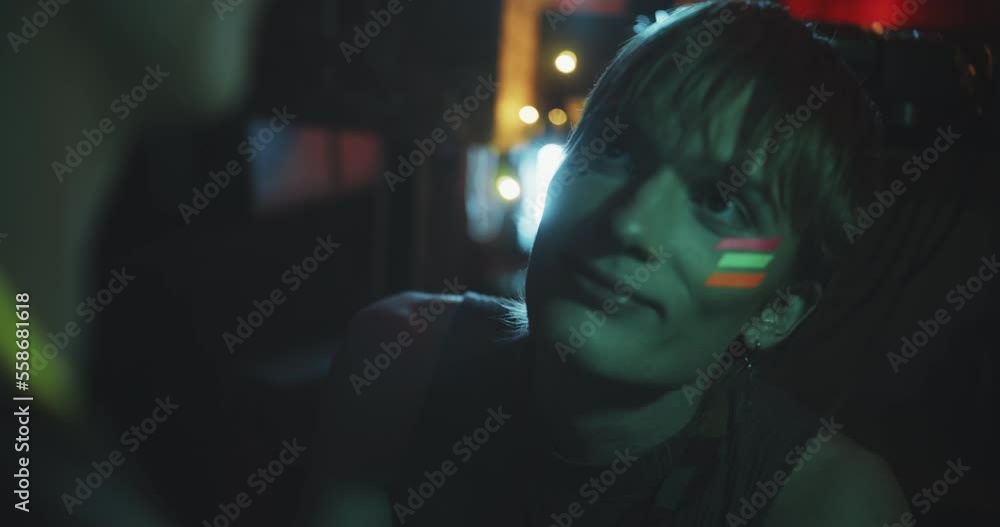 Close up of man with uv makeup in blue light Close up of man with uv makeup in blue light