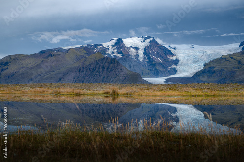 Vatnajokull Icelandic's volcanic landscape and it's glaciers in the distance. With the reflection in the water.