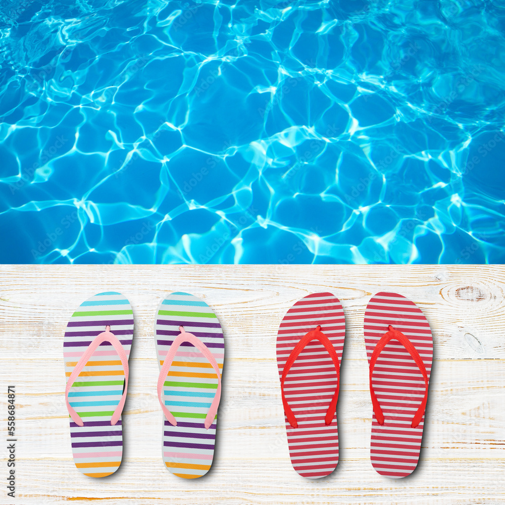 Naklejka premium Beach accessories flip flops on wooden desk, sea water background. Summer resort objects