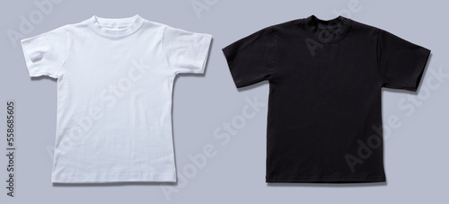 T-shirt design fashion concept, blank black and white t-shirt, shirt front isolated on gray. Mock up for sublimation.