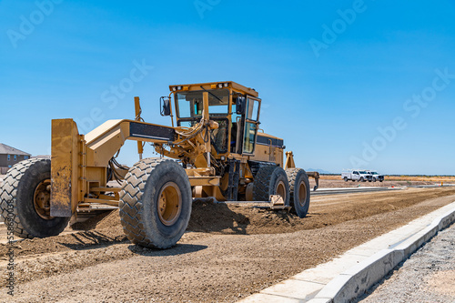 Yellow excavator, highway construction. Repair road works.
