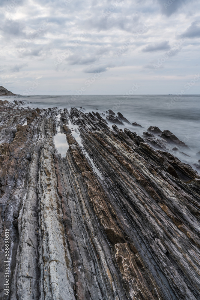 Sunset at the Flysch geological coastline, with Flysch formations in Zumaya in the Basque Country, Spain Sunset at the Flysch geological coastline, with Flysch formations in Zumaya in the Basque Country, Spain