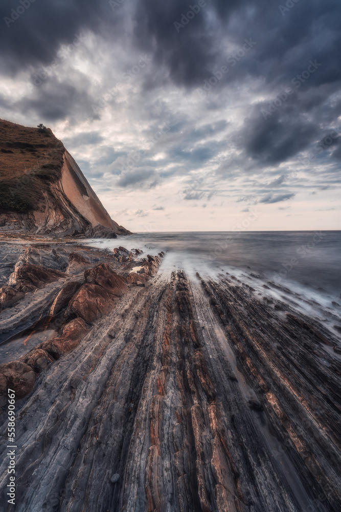 Sunset at the Flysch geological coastline, with Flysch formations in Zumaya in the Basque Country, Spain Sunset at the Flysch geological coastline, with Flysch formations in Zumaya in the Basque Country, Spain