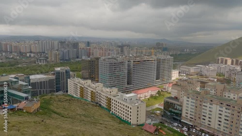 Overview of the capital of Mongolia on the cloudy day. Ulaanbaatar city view, moody weather.