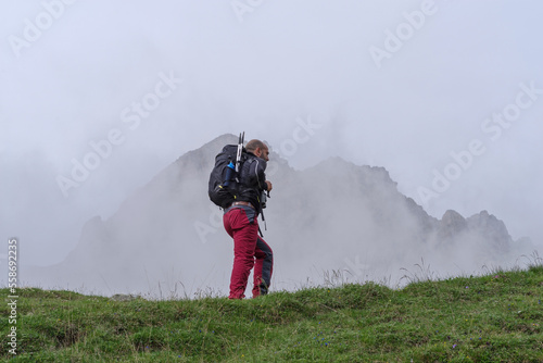 Mountain hiker in Maira Valley, Cottian Alps, Italy photo