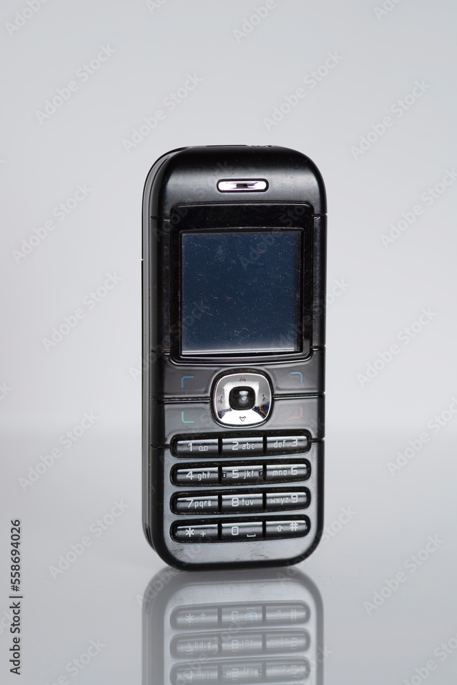Retro black mobile cell phone 1990s isolated Retro black mobile cell phone 1990s isolated