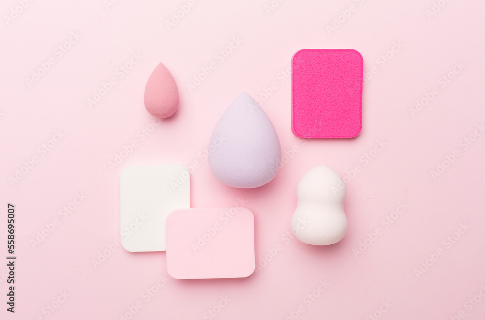 Beauty blenders on color background, top view Beauty blenders on color background, top view