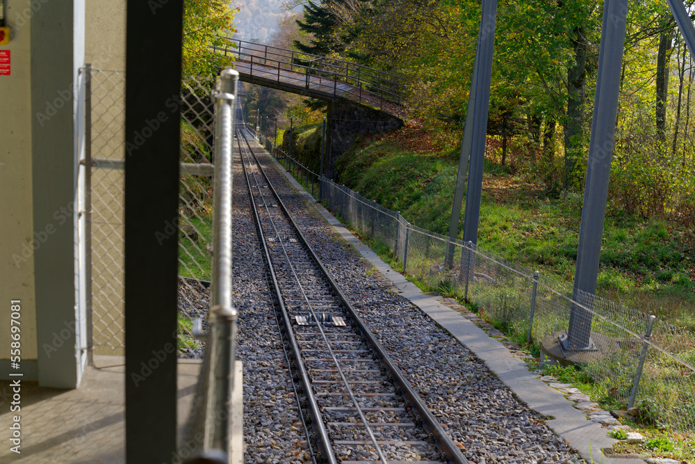 Fototapeta premium Mountain station of funicular at village of Evilard, Canton Bern, on a sunny autumn day. Photo taken November 10th, 2022, Evilard, Switzerland.