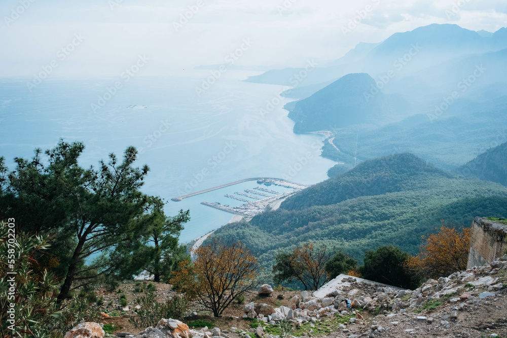 Fototapeta premium Antalya Turkey from the top of the hill. Misty weather on the coast of the sea. Mediterranean sea concept. 