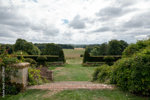 view through a formal garden down to english countryside