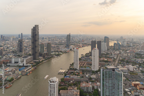 Aerial view of Bangkok Downtown Skyline  Thailand. Financial district and business centers in smart urban city in Asia. Skyscraper and high-rise buildings with Chao Phraya River.