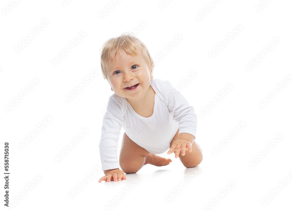 Little, happy and smiling cute baby in the studio. Portrait of a one year old baby. The concept of happiness. Little, happy and smiling cute baby in the studio. Portrait of a one year old baby. The concept of happiness.