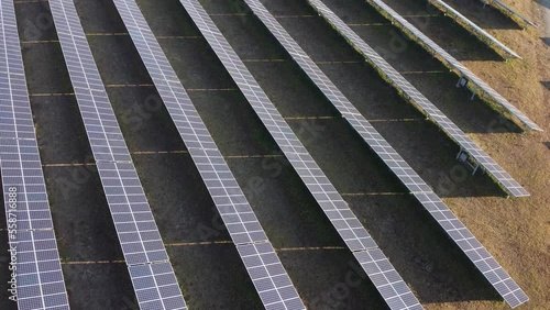 Aerial view of Solar Panels Farm (solar cell) with sunlight