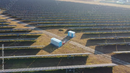 Aerial view of Solar Panels Farm (solar cell) with sunlight