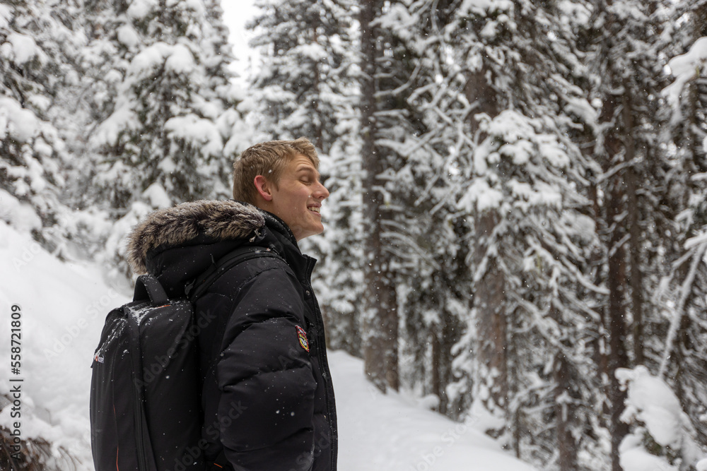 Hiker in Snowy Forest, Banff Alberta Hiking Trails Hiker in Snowy Forest, Banff Alberta Hiking Trails