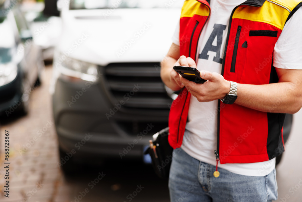 Courier man with mobile phone looking for deliver address Courier man with mobile phone looking for deliver address
