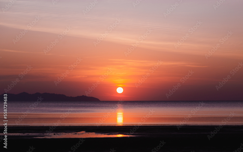 beautiful sunset with calm sea , twilight sky
