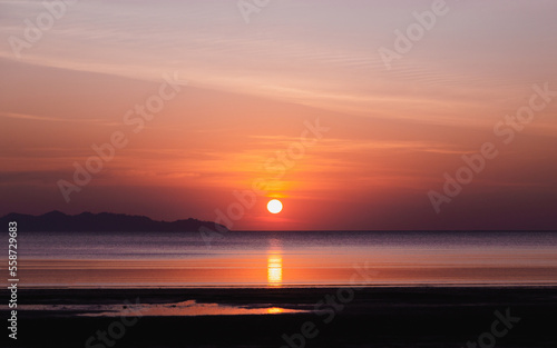 beautiful sunset with calm sea , twilight sky © sattawat