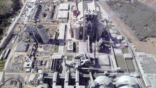 Structures of cement producing plant. Aerial view of huge industrial factory. 