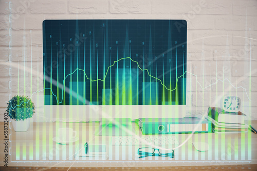 Forex graph hologram on table with computer background. Double exposure. Concept of financial markets. © peshkova