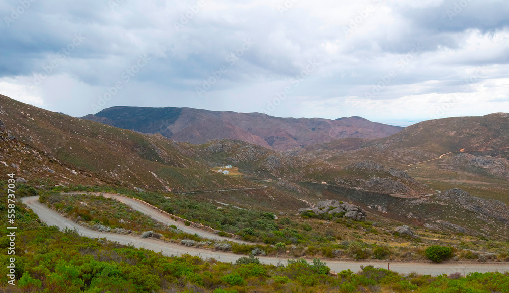 Impressive swichbacks and hairpins on the Swartberg Pass below the 1575m summit known as Die Top overlooking  Swaretberg Nature Reserve cottages.