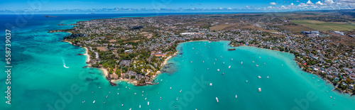 Grand Baie, Mauritius - aerial landscape view of Grand Bay, the infrastructure and buildings along the coastline and many boats on water