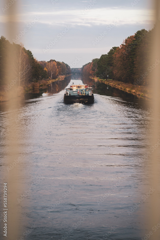 Fototapeta premium A barge on a canal photographed from a bridge