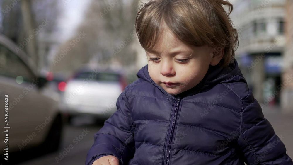 Baby toddler running in sidewalk during winter outside. Infant sprinting in city2 Baby toddler running in sidewalk during winter outside. Infant sprinting in city2