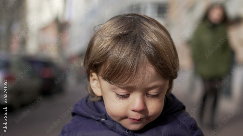 Baby toddler running in sidewalk during winter outside. Infant sprinting in city2 Baby toddler running in sidewalk during winter outside. Infant sprinting in city2