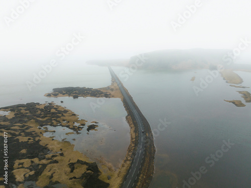 Aerial view from Reynisdrangar viewpoint, with views over the road to Dyrholaey, Arnardrangur, Reynisfjara, Dyrholavegur, Iceland. photo