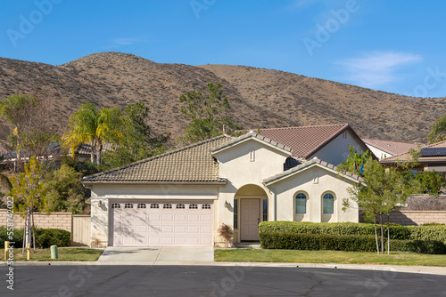 Suburban one level single family home exterior view in a sunny day, Menifee, California, USA
