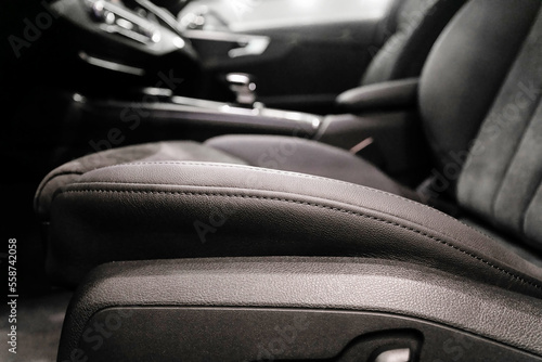 Soft focus close up of black leather driver's seat © AvokadoStudio