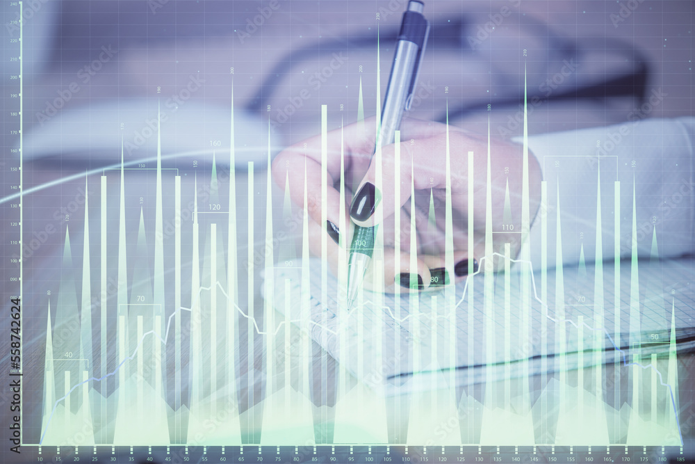 Multi exposure of hands making notes with forex chart huds. Stock market concept. Multi exposure of hands making notes with forex chart huds. Stock market concept.