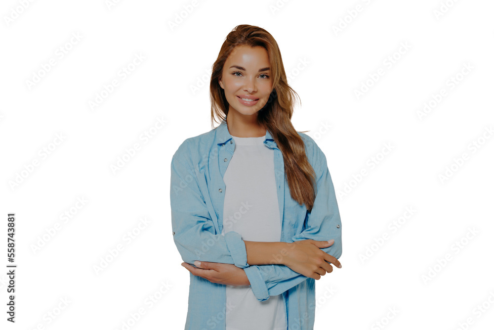 Attractive young female with crossed arms on beige background Attractive young female with crossed arms on beige background