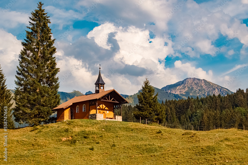 Beautiful alpine summer view with the famous Brother Klaus Chapel, Waeldele, Kleinwalsertal valley, Riezlern, Vorarlberg, Austria