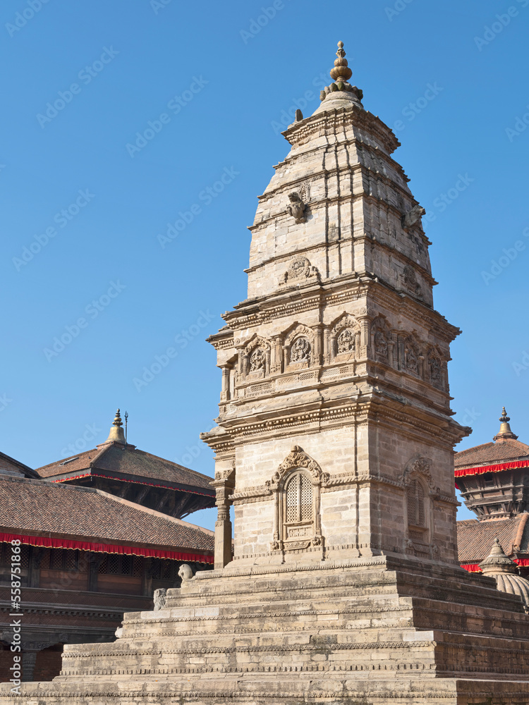 view to old tower with sculptures in Kathmandu in Nepal