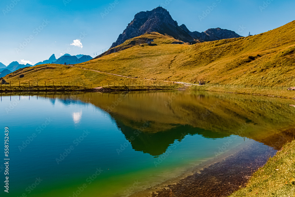 Beautiful alpine summer view with reflections in a lake at the famous Kanzelwand summit, Riezlern, Vorarlberg, Austria