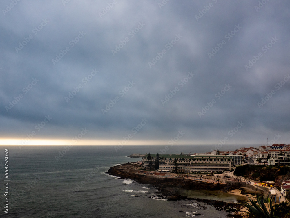 View of the South Beach with cloudy skies, on winter in Ericeira.