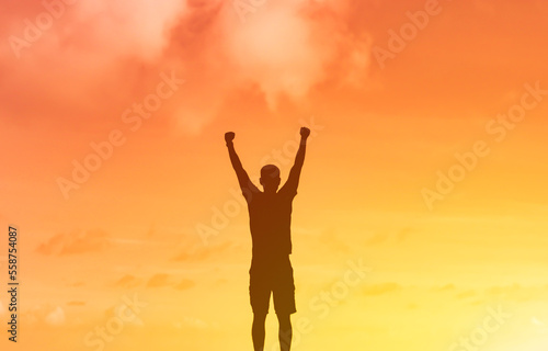 Young determined man feeling strong, and confident with fist up to the sky. 