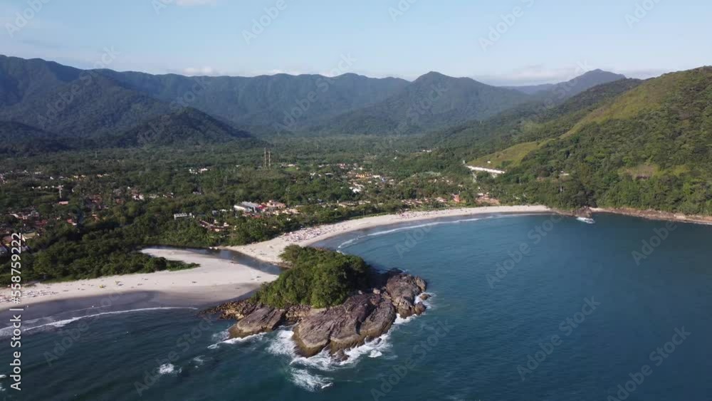 Amazing paradise beach with mountains in the background