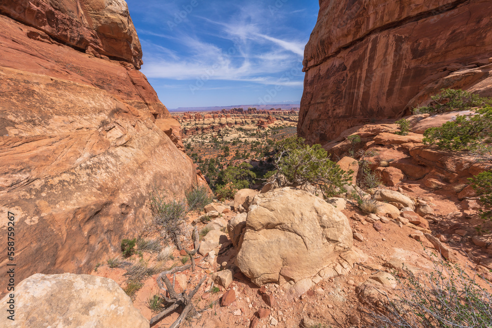 hiking the chesler park loop trail in the needles in canyonlands national park, usa hiking the chesler park loop trail in the needles in canyonlands national park, usa