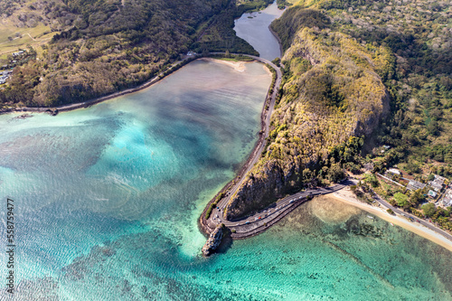 Panoramic aerial view of Maconde Bay with famous hairpin turn and mountain range in the background, Maconde, Mauritius. photo