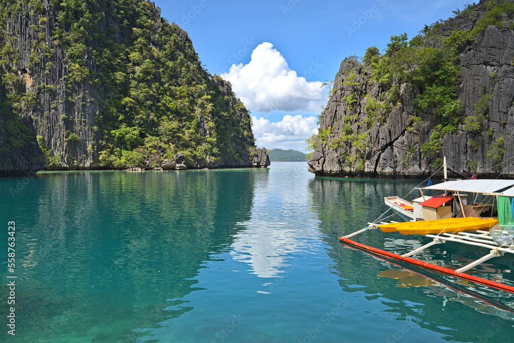 Coron Island Lagoon wita h tourist boat at the pier