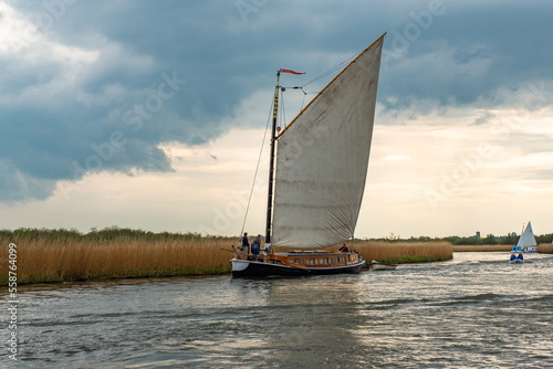 The Norfolk pleasure wherry “Hathor” sailing down the River Bure, Norfolk Broads