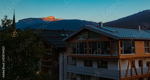 Beautiful alpine summer sunset view with a church and the Hoher Ifen summit at the famous Kleinwalsertal valley, Riezlern, Vorarlberg, Austria